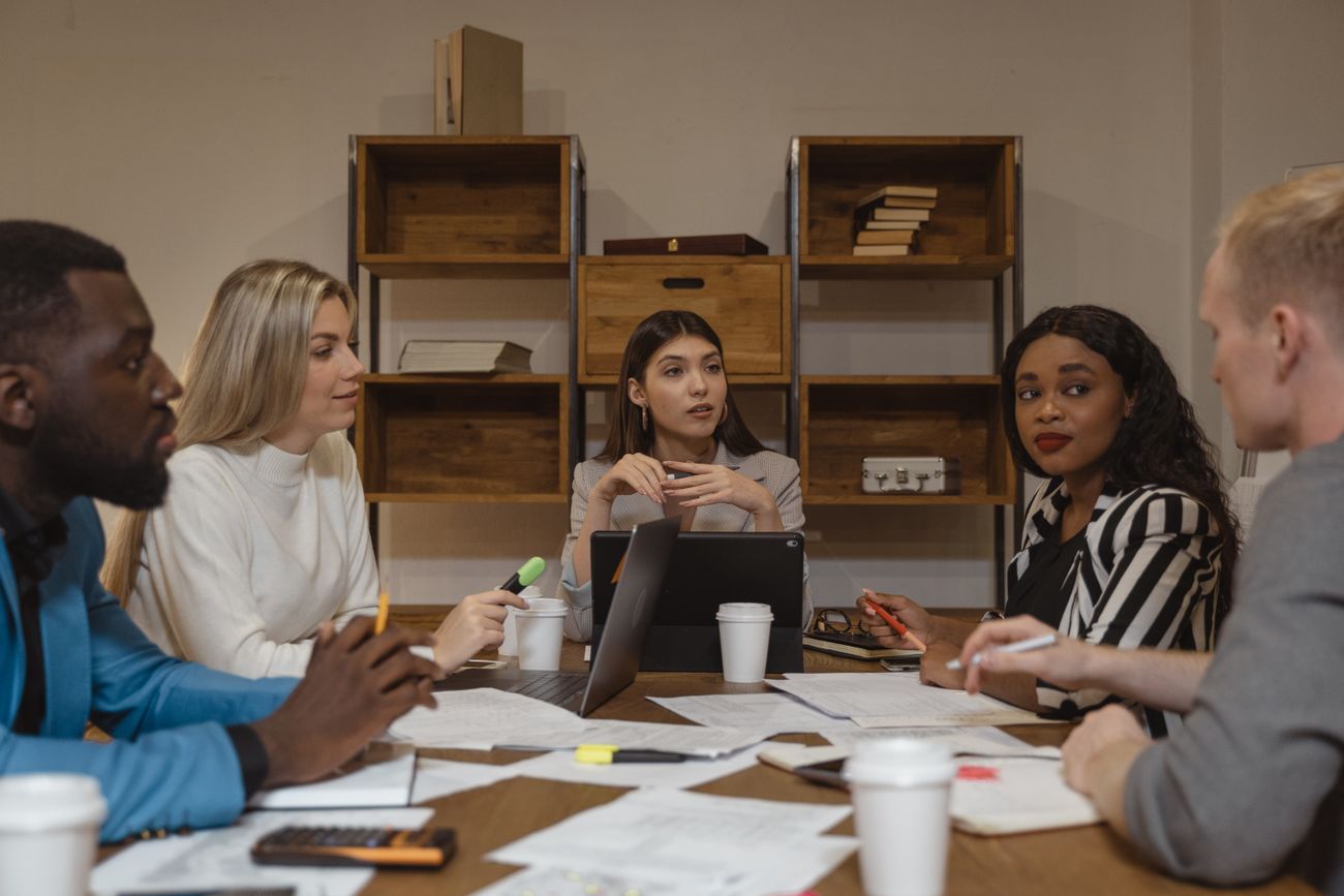 A diverse team of professionals collaborating around a table